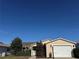 Charming single-story home featuring an attached garage at 1705 Betrillo Ct, The Villages, FL 32162