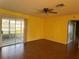 Bright living room featuring hardwood floors and sliding glass door at 1705 Betrillo Ct, The Villages, FL 32162
