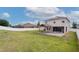 Large backyard with a pergola over a brick-paved patio, perfect for outdoor living at 1710 Alejo Dr, Apopka, FL 32712