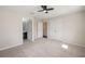 Bedroom featuring neutral carpet and an open door to a connecting bathroom at 1710 Alejo Dr, Apopka, FL 32712