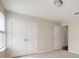 Bedroom featuring neutral carpet, a window, and a closet with double doors at 1710 Alejo Dr, Apopka, FL 32712