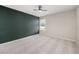 Spacious bedroom with dark wall accent and carpet flooring at 1710 Alejo Dr, Apopka, FL 32712