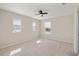 Bedroom with ceiling fan, neutral carpet, and a sunlit window providing natural light at 1710 Alejo Dr, Apopka, FL 32712