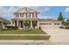 Beautiful two-story home with a manicured lawn and a three-car garage at 1710 Alejo Dr, Apopka, FL 32712