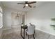 Well lit home office with neutral colors, tile flooring, and a reading chair at 1710 Alejo Dr, Apopka, FL 32712