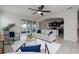 Open living room with tile floors, modern seating, and a view of the patio at 1710 Alejo Dr, Apopka, FL 32712
