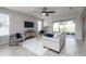 Cozy living room with tile floors, modern decor, and a sliding glass door at 1710 Alejo Dr, Apopka, FL 32712