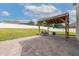 Inviting brick patio featuring a gazebo with outdoor seating and a fire pit at 1710 Alejo Dr, Apopka, FL 32712