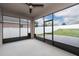 Enclosed patio with ceiling fan and view of the brick paved backyard at 1710 Alejo Dr, Apopka, FL 32712