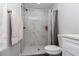 Bathroom with a walk-in shower and grey marble-look tile at 17468 Sw 36Th Ter, Ocala, FL 34473