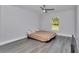 Bedroom featuring light gray walls, luxury vinyl plank flooring and a modern ceiling fan at 17468 Sw 36Th Ter, Ocala, FL 34473