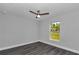 Bright bedroom features stylish gray floors, neutral walls and a ceiling fan at 17468 Sw 36Th Ter, Ocala, FL 34473