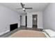 Bedroom featuring light gray walls, luxury vinyl plank flooring, and ensuite bathroom at 17468 Sw 36Th Ter, Ocala, FL 34473