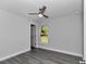 Bright bedroom features stylish gray floors, neutral walls and a ceiling fan at 17468 Sw 36Th Ter, Ocala, FL 34473