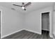 Cozy bedroom with gray floors has a ceiling fan and spacious closet at 17468 Sw 36Th Ter, Ocala, FL 34473