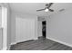 Bedroom with gray floors and white closet doors at 17468 Sw 36Th Ter, Ocala, FL 34473