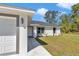 Close-up view of the home's entrance, showcasing the walkway, landscaping, and design elements at 17468 Sw 36Th Ter, Ocala, FL 34473