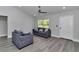 Bright living room with wood-look floors, neutral paint and modern furnishings at 17468 Sw 36Th Ter, Ocala, FL 34473