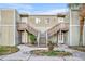 Cozy two-story condo featuring a symmetrical wooden staircase at 186 Scottsdale Sq # 186, Winter Park, FL 32792