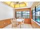 Bright breakfast nook with large windows and wood paneling at 2102 E Atmore Cir, Deltona, FL 32725