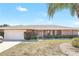 Charming brick home with a two-car garage and well-maintained landscaping at 2102 E Atmore Cir, Deltona, FL 32725