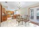 Bright kitchen with wood cabinets, stainless appliances, and a breakfast table area at 2102 E Atmore Cir, Deltona, FL 32725
