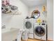 Convenient laundry room equipped with washer, dryer, and storage, making laundry days easier at 2102 E Atmore Cir, Deltona, FL 32725