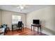 Office area featuring wood floor, ceiling fan and window, and a desk work space at 222 Paul Mcclure Ct, Casselberry, FL 32707