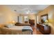 This spacious bedroom has two beds, wood floors, and a bright, airy feel from the natural light and ceiling fan at 222 Paul Mcclure Ct, Casselberry, FL 32707