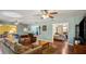 Comfortable living room with hardwood floors, neutral paint, and doorway to other rooms at 222 Paul Mcclure Ct, Casselberry, FL 32707
