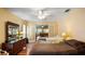 Bedroom with two beds, hardwood floors, and lots of natural light from windows at 222 Paul Mcclure Ct, Casselberry, FL 32707