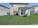 A beautiful backyard with a covered patio is perfect for outdoor relaxation and entertainment at 2412 Gold Dust Dr, Clermont, FL 34715
