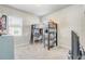 Bedroom featuring plush carpeting, a bunk bed with desk, and a view of the yard at 2412 Gold Dust Dr, Clermont, FL 34715