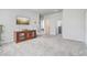 Open bonus room with plush carpeting, media center, and easy access to other rooms at 2412 Gold Dust Dr, Clermont, FL 34715