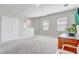 Spacious bonus room featuring plush carpeting, and plentiful natural light at 2412 Gold Dust Dr, Clermont, FL 34715