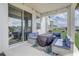 A covered patio provides a relaxing outdoor space with comfortable seating and an open view at 2412 Gold Dust Dr, Clermont, FL 34715