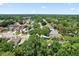 Sprawling neighborhood with mature trees and well-maintained homes from an aerial view at 2515 Wekiva Walk Way, Apopka, FL 32703