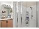 Bathroom featuring a glass enclosed shower, vanity with granite countertop, and updated fixtures at 2515 Wekiva Walk Way, Apopka, FL 32703