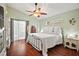 Bedroom with hardwood floors, neutral walls, a ceiling fan, and natural light at 2515 Wekiva Walk Way, Apopka, FL 32703