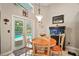 Cozy breakfast nook with views of the pool and access to the outdoor area at 2515 Wekiva Walk Way, Apopka, FL 32703