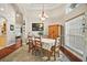Light-filled dining room featuring a tray ceiling, chandelier, and large window at 2515 Wekiva Walk Way, Apopka, FL 32703