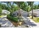 Charming home with well-manicured landscaping, mature trees, and a spacious driveway at 2515 Wekiva Walk Way, Apopka, FL 32703