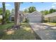 Charming exterior with a spacious driveway and beautifully landscaped front yard at 2515 Wekiva Walk Way, Apopka, FL 32703