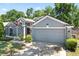 Charming home with a two-car garage and well-maintained landscaping at 2515 Wekiva Walk Way, Apopka, FL 32703