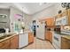Bright kitchen features granite counters, tile flooring, and stainless steel appliances at 2515 Wekiva Walk Way, Apopka, FL 32703