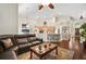 Spacious living area with a view of the kitchen and breakfast bar seating at 2515 Wekiva Walk Way, Apopka, FL 32703