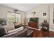Living room with hardwood floors, decorative fish mounts, and a large aquarium at 2515 Wekiva Walk Way, Apopka, FL 32703