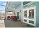 Covered patio area featuring red seating with an outdoor ceiling fan at 2515 Wekiva Walk Way, Apopka, FL 32703