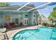 Relaxing pool view highlighting the screened enclosure and outdoor seating area at 2515 Wekiva Walk Way, Apopka, FL 32703