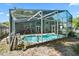 Beautiful screened-in pool area with a seahorse statue and comfortable seating at 2515 Wekiva Walk Way, Apopka, FL 32703